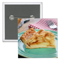 Slice of fresh baked apple pie on plate buttons