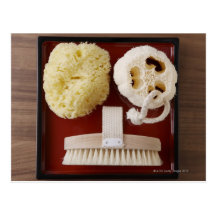 Sponge, loofah, brush on red tray post card