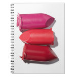 Stack of broken lipstick note books