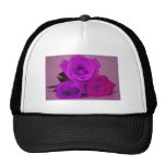 Three roses, tinted purple on a purple back mesh hat