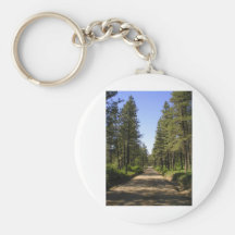 Tree lined dirt road key chains
