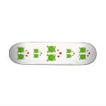 Two green frogs with red hearts. skateboard