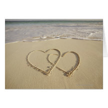 Two overlying hearts drawn on the beach cards