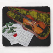 Violin and red rose on black background mouse pad