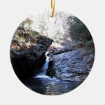 Waterfall between rocky outcroppings ornament