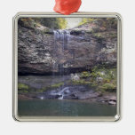Waterfall flowing down the cliffs into a pool ornaments