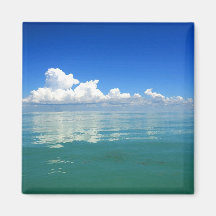 White cloud over a placid ocean magnet