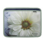 white flower on music MacBook Air sleeve