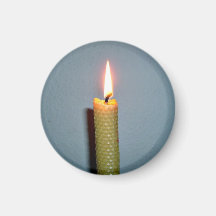 Yellow Candle flame against white wall Fridge Magnets