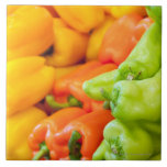 Yellow, red and green pepper on sale at farmer's ceramic tiles