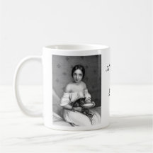 Young girl with kitten and bowl of milk mug