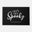 Search for funny halloween doormats Black and white