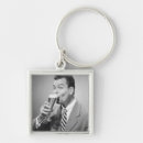 Search for businessman key rings Looking at camera
