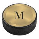 Search for gold hockey pucks Modern