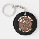 Search for fossil key rings Paleontologist