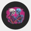 Search for hand holding stickers Skull