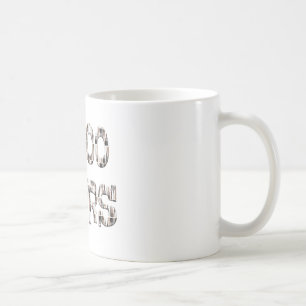 10000 hours with an overlay of paint brushes. coffee mug