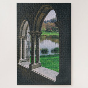 13th century Mediaeval gothic cloister by a lake Jigsaw Puzzle