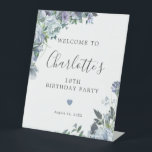 18th Birthday Dusty Blue Floral Welcome Pedestal Sign<br><div class="desc">Welcome your guests with this elegant tabletop pedestal sign. Pretty dusty blue roses,  peonies and wildflowers decorate two corners. A tiny heart adds a little loving touch. A classic and easy-to-read font combination takes only minutes to personalise.</div>