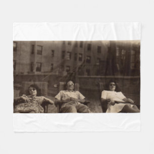 1940s three people relaxing on the roof fleece blanket