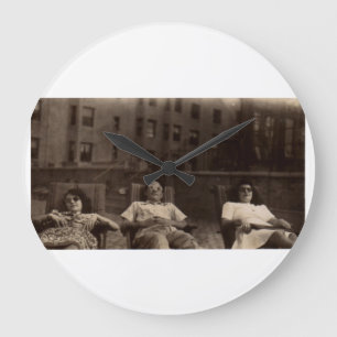 1940s three people relaxing on the roof large clock