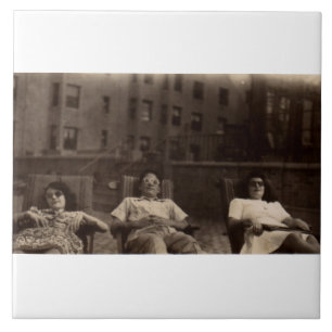 1940s three people relaxing on the roof tile