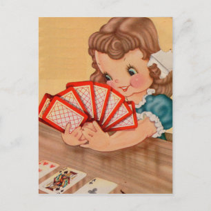1950s adorable little girl playing cards