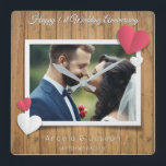 1st Wedding Anniversary  – Rustic Wood & Hearts Square Wall Clock<br><div class="desc">Celebrate your first wedding anniversary with this beautiful personalised wall clock! Featuring a rustic wood background, romantic hearts, and your custom photo in the centre, this design blends charm and warmth for a timeless keepsake. The elegant "1st Wedding Anniversary" script (Great Vibes) pairs perfectly with clean modern text (Quicksand) to...</div>