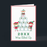 2020 Was Elfed Up | Christmas | Toilet Paper Holid Holiday Card<br><div class="desc">This funny holiday card features some busy elves stacking up rolls of toilet paper. The message at the bottom reads "2020 was Elfed Up" in a green font on a bright white background. Colours include green, red, brown and pink. The has another elf decorating a Christmas tree on a red...</div>