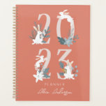 2023 Red Winter Floral & Foliage Bunny Planner<br><div class="desc">This cute 2023 planner features a white bunnies with winter floral and foliage on a red background. The reverse side features a burgundy background with botanical patterns. Personalise it for your needs.</div>