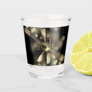 2024 new year with golden bubbles shot glass
