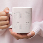 2025 Calendar Mug | Soft Pastel Pink |<br><div class="desc">Enjoy your favourite beverages while staying organised with this 2025 calendar mug in a soft pastel pink design. Combining practicality and elegance, this mug features a full-year calendar that’s perfect for quick date referencing. The gentle pastel pink hue adds a touch of sophistication, making it an ideal choice for your...</div>