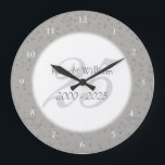 25th Wedding Anniversary Silver Stardust Confetti Large Clock<br><div class="desc">25TH WEDDING ANNIVERSARY SILVER STARDUST CONFETTI CLOCK. Personalised with your names in faux silver over a beautiful script "25" (or a monogram initial),  on a delicate silver stardust confetti background. Designed by Pure Piglet© at www.zazzle.com/purepiglet*.</div>