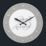 25th Wedding Anniversary Silver Stardust Confetti Large Clock<br><div class="desc">25TH WEDDING ANNIVERSARY SILVER STARDUST CONFETTI CLOCK. Personalised with your names in faux silver over a beautiful script "25" (or a monogram initial),  on a delicate silver stardust confetti background. Designed by Pure Piglet© at www.zazzle.com/purepiglet*.</div>