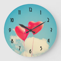 2 Bright Red Heart Shaped balloons Floating Upward