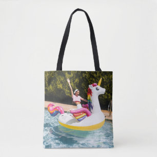 2 children riding on white and red inflatable boat tote bag