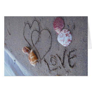 2 Hearts in the sand with shells with Love