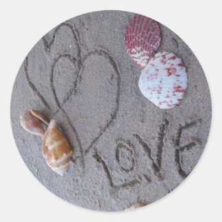 2 Hearts in the sand with shells with Love Classic Round Sticker
