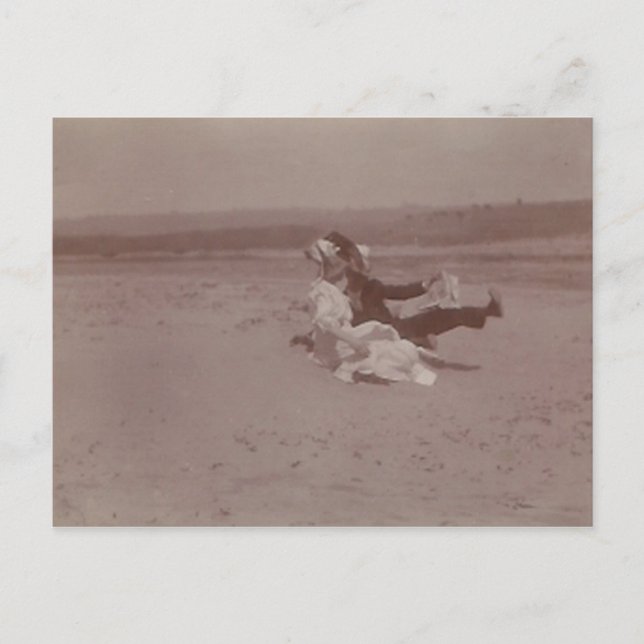 2 people at beach losing hats postcard (Front)