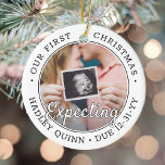 2 Photo 1st Xmas Expecting Baby New Parents Modern Ceramic Tree Decoration<br><div class="desc">Celebrate the precious gift of your newest family member with a stylish two photo round ceramic ornament. Gender neutral design is suitable for a new baby boy or girl. Wording and pictures on this template are simple to personalise, and can be different or the same on front and back. (IMAGE...</div>