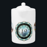 2 Photos 19th Wedding Anniversary<br><div class="desc">A little stuck on what to give this lovely couple for their 19th wedding anniversary? Then perhaps a simple then and now photos teapot with my sweet acquamarine gem graphic,  all  to set off their vitality in two heart frames,  will be exactly what you're looking for!?</div>