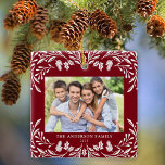 2 Photos Family Winter Greenery Red Christmas Ceramic Ornament<br><div class="desc">This dark red Christmas ornament showcases an elegant white winter greenery illustration that frames the horizontal photo. The design offers space for 2 photos,  one on the front and another on the back. Personalise this lovely keepsake ornament with your family name and the year.</div>