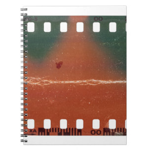 35mm filmstrip start, cool scratches. notebook