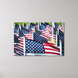 400 flags waving proudly in a field canvas print