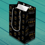 40th Birthday 1984 Black Gold Chic Elegant Medium Gift Bag<br><div class="desc">40th Birthday Chic 1984 Themed Black & Gold Elegant Gift Bags. Celebrate the journey of the vintage years with our 40th Birthday 1984 Black and Gold Chic Elegant Gift Bags. Wrapped in class and elegance, these high-quality gift bags offer a fully personalised touch, reflecting the chic vibes of the birthday....</div>