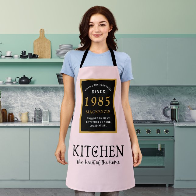 40th Birthday Queen Of Kitchen Heart Of Home Pink Apron (Personalized 40th birthday pink apron worn by a woman in the kitchen)