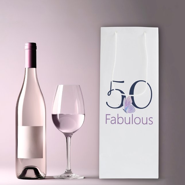50 and Fabulous Boho Butterfly 50th Birthday Wine Gift Bag (50th birthday fabulous wine bag next to a wine glass and bottle.)