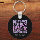 50 Years Later Still My Favorite Notification  Key Ring<br><div class="desc">Celebrate five decades of connection with this modern, tech-inspired design. Featuring bold, vibrant typography in soft lavender and blush pink, this high-contrast graphic perfectly captures the enduring bond of a 50th anniversary. A sleek, minimalist heart and notification bell icon add a contemporary touch to a classic milestone. Ideal for anniversaries,...</div>