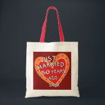 50th Anniversary or Any Yr Funny Romantic Gift Tote Bag<br><div class="desc">A one-of-a-kind, fun anniversary gift for family or friends. What a conversation starter when they're out and about shopping or toting their treasures around. Whimsy is the word for this red and orange decorated heart proclaiming "JUST MARRIED... ..50 YEARS AGO". See more wedding anniversary gifts at Zigglets here at Zazzle....</div>