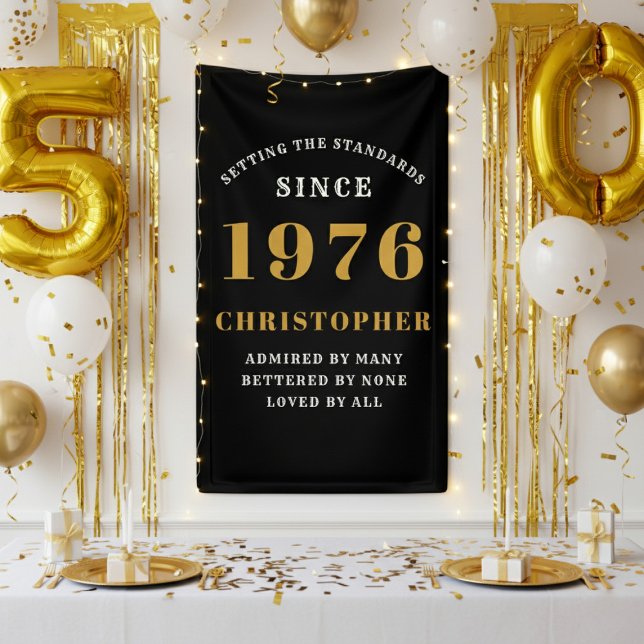 50th Birthday Born 1976 Add Name Black Gold Banner (1976 wall banner against a white wall with gold party decorations.)